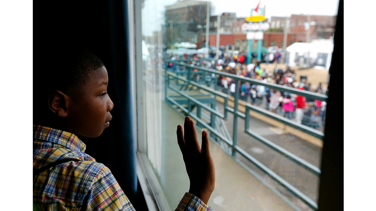 Child looking out of the window at the Lorraine Motel