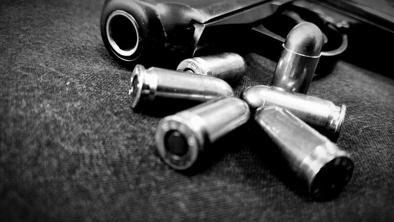 Close-Up Of Handgun And Bullets (Credit: Sebastian Wasiak / EyeEm / Getty Images) 
