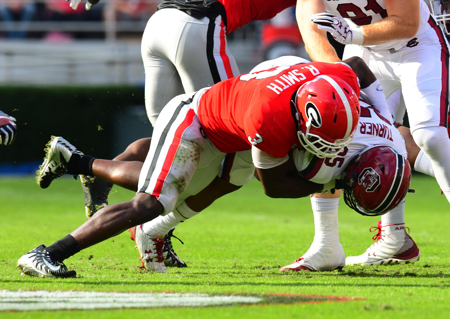 ATHENS, GA - NOVEMBER 4: A. J. Turner #25 of the South Carolina Gamecocks is tackled by Roquan Smith #3 of the Georgia Bulldogs at Sanford Stadium on November 4, 2017 in Athens, Georgia. (Photo by Scott Cunningham/Getty Images)