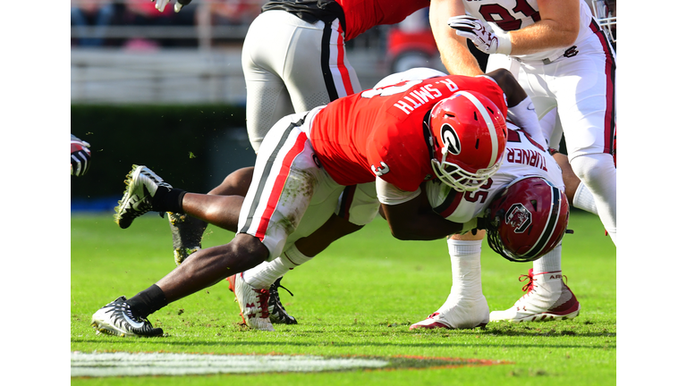 ATHENS, GA - NOVEMBER 4: A. J. Turner #25 of the South Carolina Gamecocks is tackled by Roquan Smith #3 of the Georgia Bulldogs at Sanford Stadium on November 4, 2017 in Athens, Georgia. (Photo by Scott Cunningham/Getty Images)