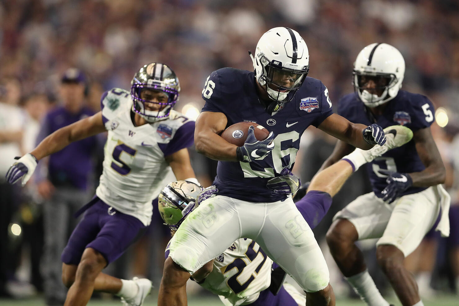 GLENDALE, AZ - DECEMBER 30: Running back Saquon Barkley #26 of the Penn State Nittany Lions rushes the football against the Washington Huskies during the second half of the Playstation Fiesta Bowl at University of Phoenix Stadium on December 30, 2017 in Glendale, Arizona. The Nittany Lions defeated the Huskies 35-28. (Photo by Christian Petersen/Getty Images)