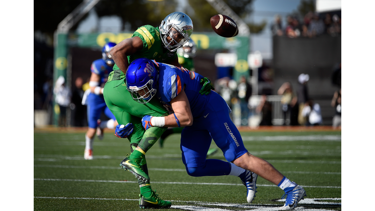 LAS VEGAS, NV - DECEMBER 16: Tony Brooks-James #20 of the Oregon Ducks fumbles the ball under pressure from Leighton Vander Esch #38 of the Boise State Broncos during the first half of the Las Vegas Bowl at Sam Boyd Stadium on December 16, 2017 in Las Vegas, Nevada. Boise State won 38-28. (Photo by David Becker/Getty Images)