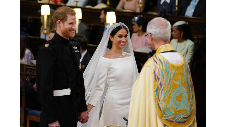 Prince Harry and Meghan Markle stand at the altar