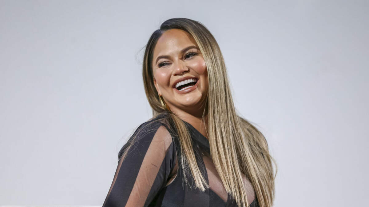 Chrissy Teigen reveals postpartum body in medical mesh underwear as she  cradles baby Miles