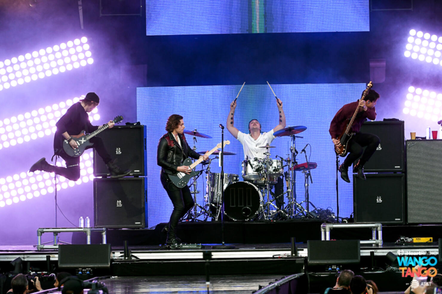 Michael Clifford, Luke Hemmings, Ashton Irwin (on drum riser), and Calum Hood of music group 5 Seconds of Summer perform onstage during the 2018 iHeartRadio Wango Tango by AT&T at Banc of California Stadium on June 2, 2018 in Los Angeles, California.