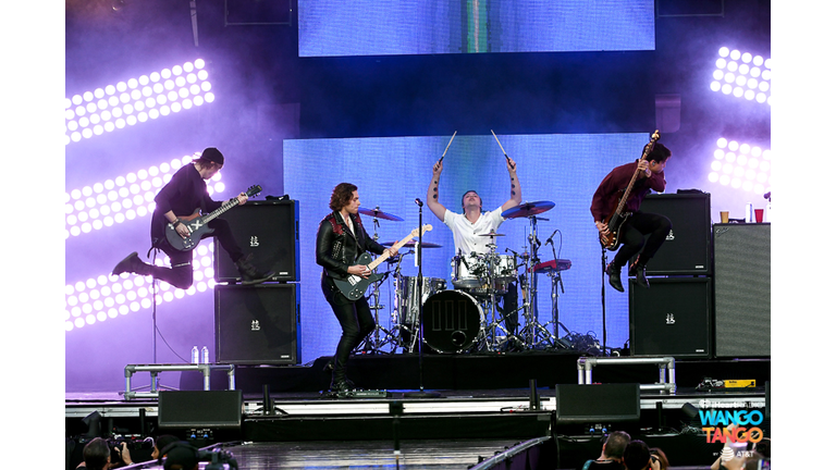 Michael Clifford, Luke Hemmings, Ashton Irwin (on drum riser), and Calum Hood of music group 5 Seconds of Summer perform onstage during the 2018 iHeartRadio Wango Tango by AT&T at Banc of California Stadium on June 2, 2018 in Los Angeles, California.