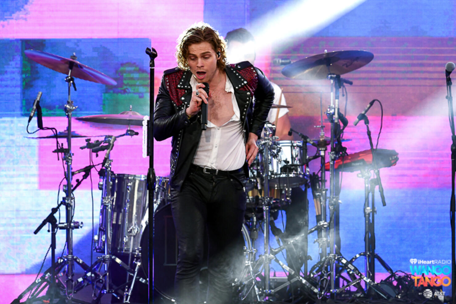 Michael Clifford, Luke Hemmings, Ashton Irwin (on drum riser), and Calum Hood of music group 5 Seconds of Summer perform onstage during the 2018 iHeartRadio Wango Tango by AT&T at Banc of California Stadium on June 2, 2018 in Los Angeles, California.
