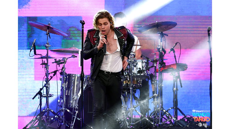 Michael Clifford, Luke Hemmings, Ashton Irwin (on drum riser), and Calum Hood of music group 5 Seconds of Summer perform onstage during the 2018 iHeartRadio Wango Tango by AT&T at Banc of California Stadium on June 2, 2018 in Los Angeles, California.