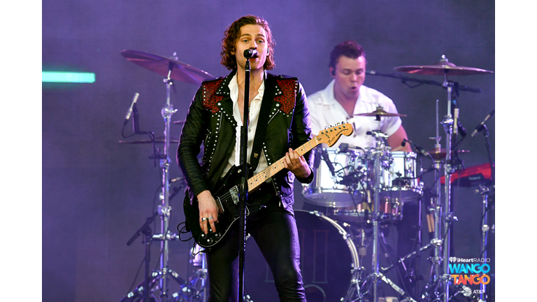 Michael Clifford, Luke Hemmings, Ashton Irwin (on drum riser), and Calum Hood of music group 5 Seconds of Summer perform onstage during the 2018 iHeartRadio Wango Tango by AT&T at Banc of California Stadium on June 2, 2018 in Los Angeles, California.