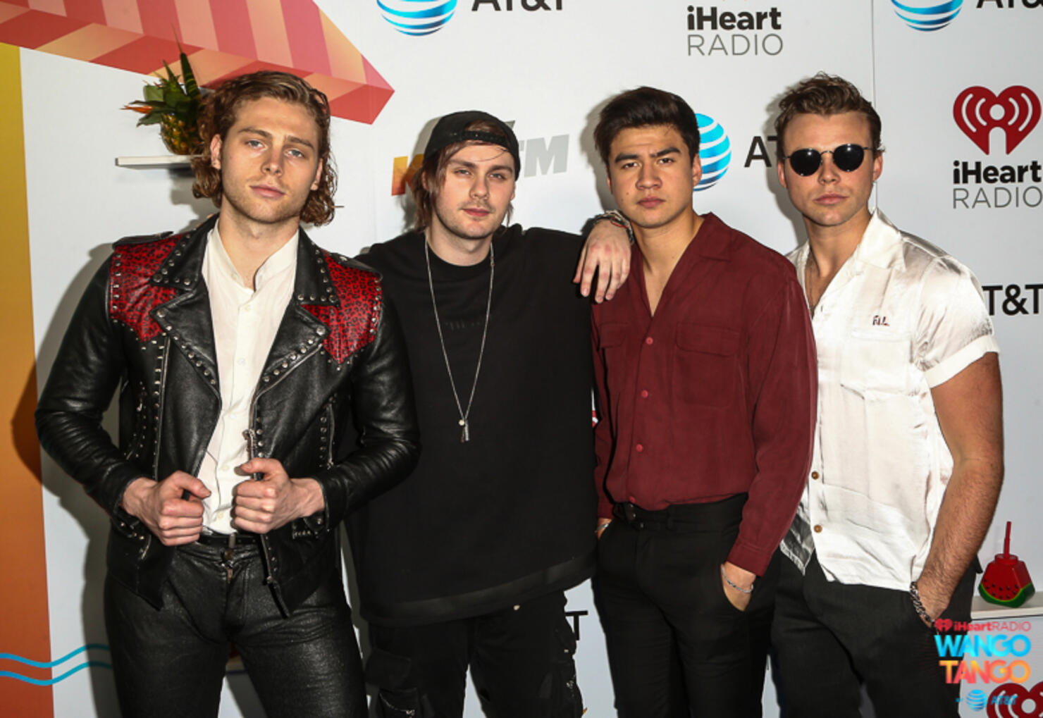  Ashton Irwin, Michael Clifford, Calum Hood and Luke Hemmings of 5 Seconds of Summer arrive at the 2018 iHeartRadio Wango Tango by AT&T at Banc of California Stadium on June 2, 2018 in Los Angeles, California.