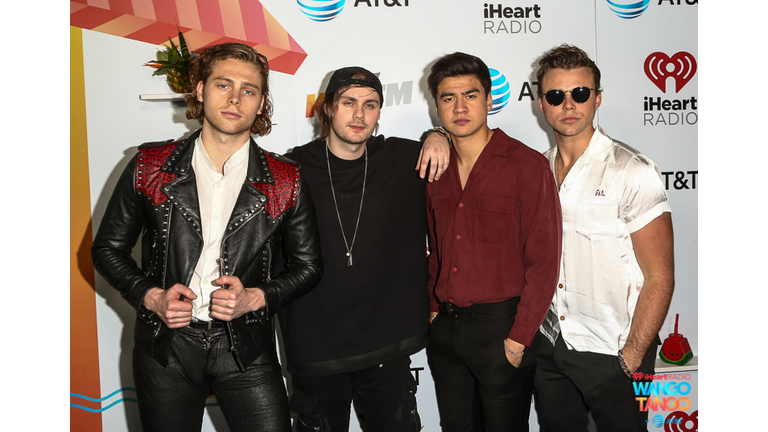  Ashton Irwin, Michael Clifford, Calum Hood and Luke Hemmings of 5 Seconds of Summer arrive at the 2018 iHeartRadio Wango Tango by AT&T at Banc of California Stadium on June 2, 2018 in Los Angeles, California.