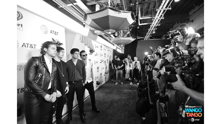  Ashton Irwin, Michael Clifford, Calum Hood and Luke Hemmings of 5 Seconds of Summer arrive at the 2018 iHeartRadio Wango Tango by AT&T at Banc of California Stadium on June 2, 2018 in Los Angeles, California.