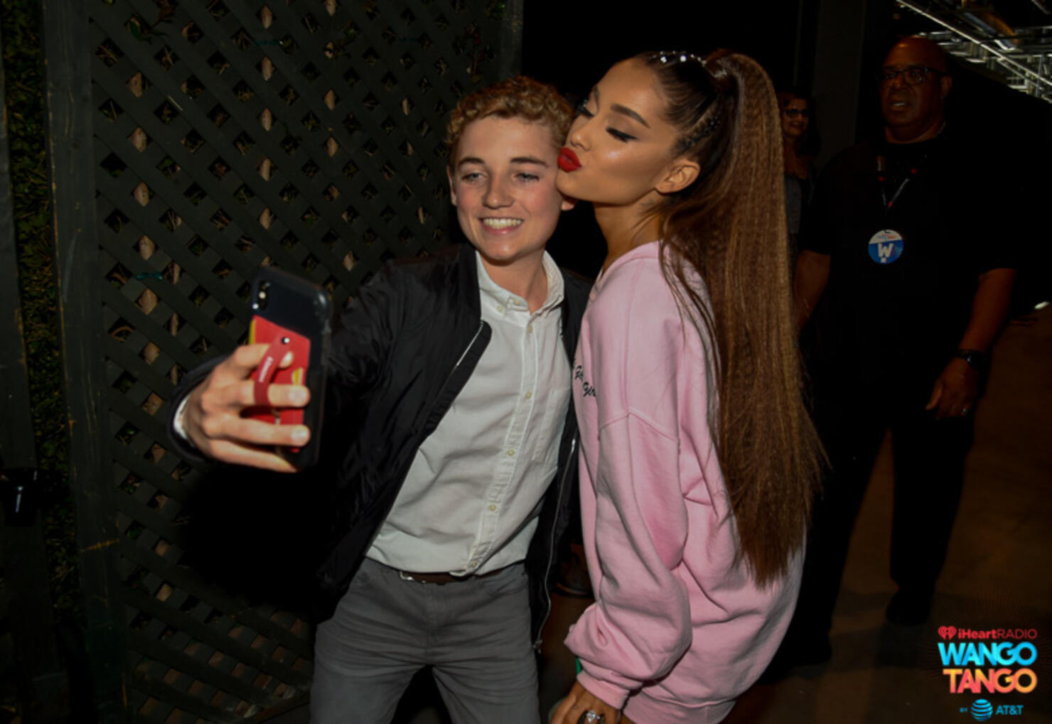 Ryan McKenna (L) and Ariana Grande pose for a selfie photo backstage at the 2018 iHeartRadio Wango Tango by AT&T at Banc of California Stadium on June 2, 2018 in Los Angeles, California. 