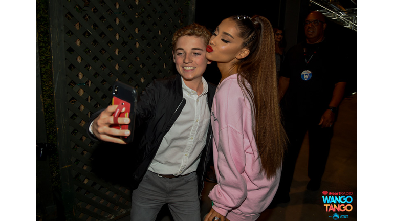 Ryan McKenna (L) and Ariana Grande pose for a selfie photo backstage at the 2018 iHeartRadio Wango Tango by AT&T at Banc of California Stadium on June 2, 2018 in Los Angeles, California. 
