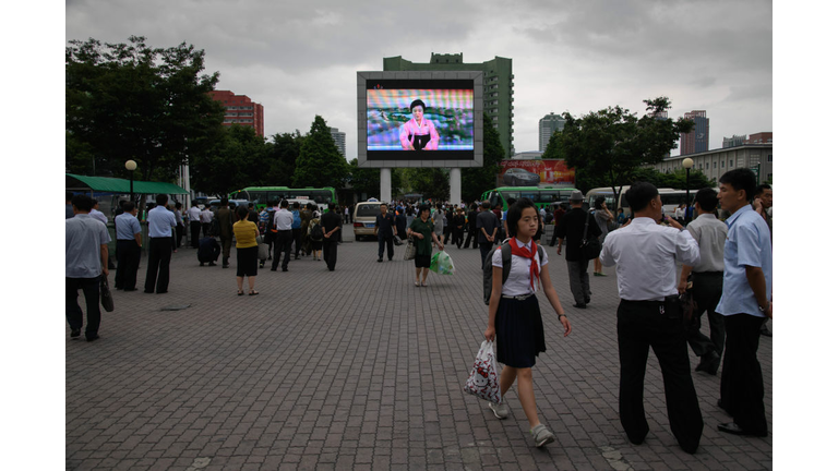 A television screen shows news reader Ri Chun Hee announcing the arrival of North Korean leader Kim Jong Un to Singapore ahead of his meeting with US president Donald Trump, during an evening bulletin in Pyongyang on June 11, 2018. (Photo by Ed JONES / AFP) 