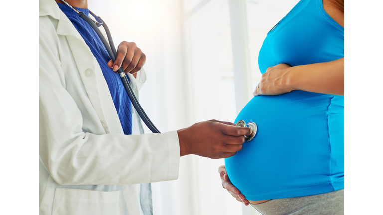 Physician Checking Pregnant Woman (Credit Getty Images - Royalty Free)