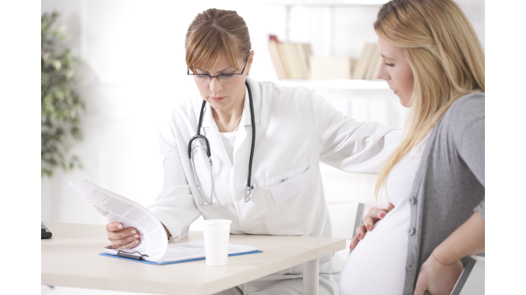 Physician with Pregnant Mother (Credit: Getty Images - Royalty Free)
