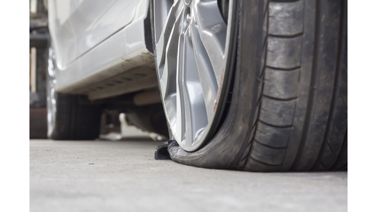 Burst Tire Car (	iStock / Getty Images Plus ) 