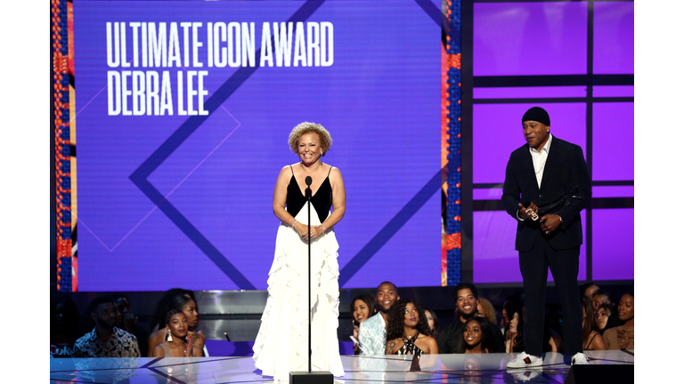 LL Cool J stands alongside Debra Lee to award her at the 2018 BET Awards