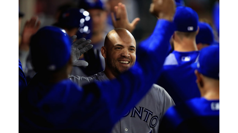 Steve Pearce #28 of the Toronto Blue Jays is congratulated in the dugout after hitting a three-run homerun during the ninth inning of a game against the Los Angeles Angels of Anaheim at Angel Stadium on June 23, 2018 in Anaheim, California. (Photo by Sean M. Haffey/Getty Images)
