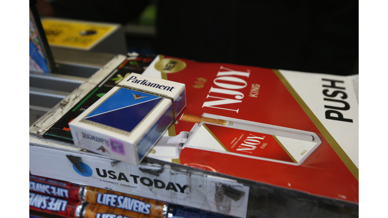  Cigarettes await sale at a sidewalk newsstand on April 23, 2013 in New York City. The legal age to buy cigarettes could rise to 21 from 18 in New York City under a proposal officials released this week, making New York the strictest of any major U.S. city on smoking age limits. (Photo by John Moore/Getty Images)