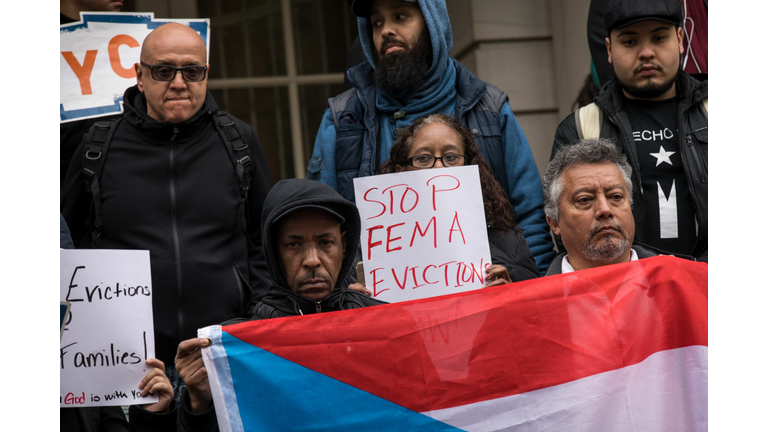 Activists rally in support of Puerto Rican families displaced by Hurricane Maria, on the steps of City Hall, April 19, 2018 in New York City. Many Puerto Rican natives left the island last fall to escape the destruction left by Hurricane Maria and some are living in New York City in shelters and hotels as part of Federal Emergency Management Agency's (FEMA) Transitional Shelter Assistance Program. With nearly 200 families receiving the FEMA benefits that fund hotel and shelter stays in the city, New York City Mayor Bill de Blasio has written a letter to FEMA asking the agency to extend sheltering assistance benefits beyond the May 14 deadline. (Photo by Drew Angerer/Getty Images)