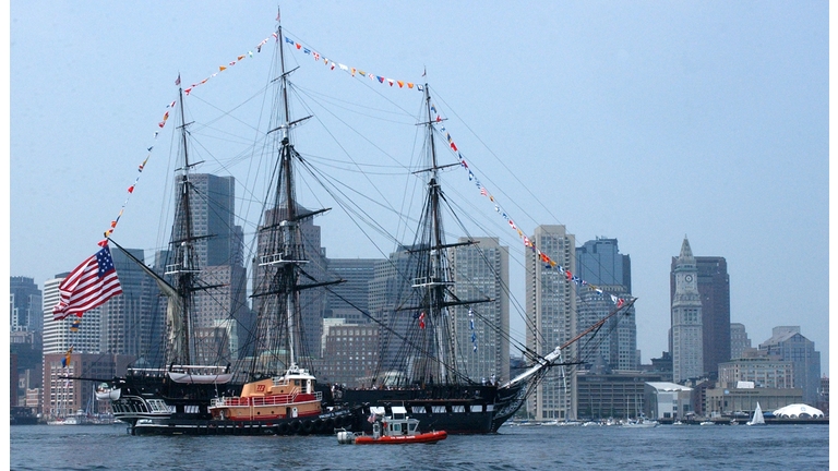  In this handout photo provided by the U.S. Coast Guard, multiple Coast Guard resources escort the USS Constitution, Boston's beloved 'Old Iron Sides,' June 11, 2005 in Boston, Massachusetts. The boat went out to an island in south Boston where the USS Constitution fired its 21 gun salute and was then brought back to her dock in Charlestown Navy Yard. (Photo by PA3 Kelly Newlin/U.S. Coast Guard via Getty Images)