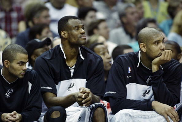 Tony Parker, David Robinson and Tim Duncan