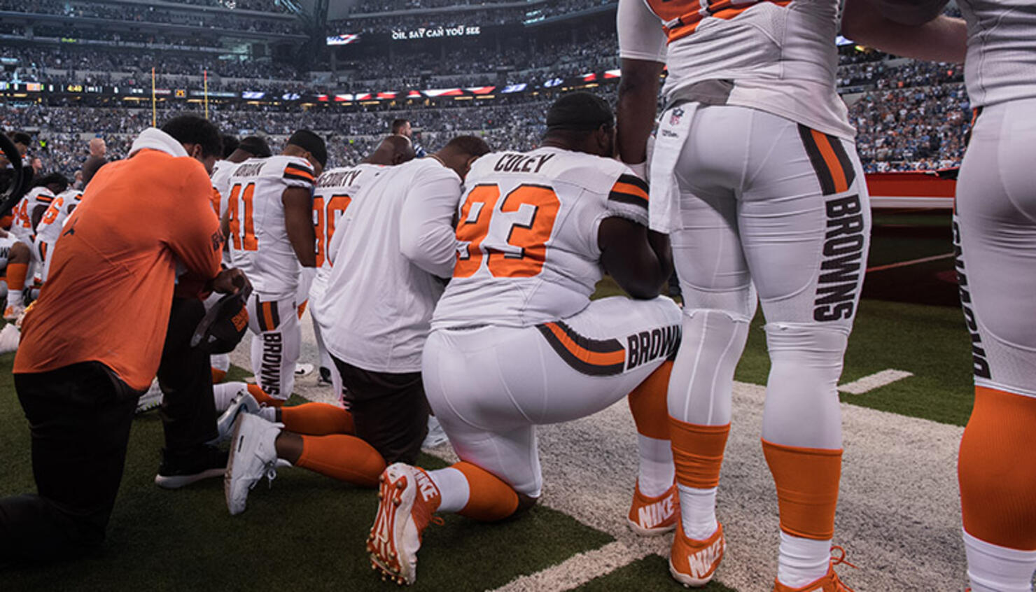 Cleveland Browns players take a knee during the national anthem
