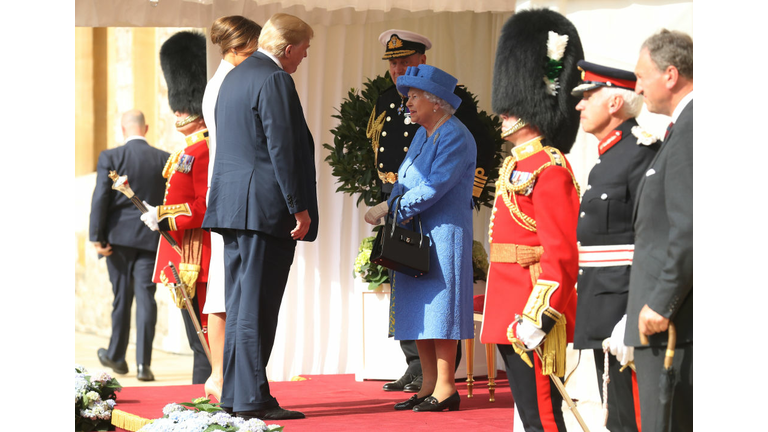 WINDSOR, ENGLAND - JULY 13: Queen Elizabeth II greets President of the United States, Donald Trump and First Lady, Melania Trump at Windsor Castle on July 13, 2018 in Windsor, England. Her Majesty welcomed the President and Mrs Trump at the dais in the Quadrangle of the Castle. A Guard of Honour, formed of the Coldstream Guards, gave a Royal Salute and the US National Anthem was played. The Queen and the President inspected the Guard of Honour before watching the military march past. The President and First Lady then joined Her Majesty for tea at the Castle. (Photo by Chris Jackson/Getty Images)