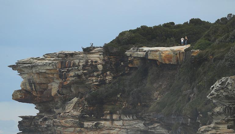 American Tourists Falls Off Australian Cliff While Taking A Selfie | iHeart