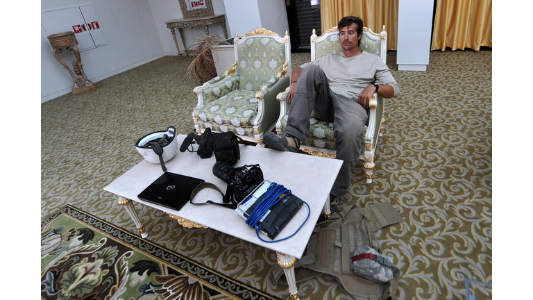 A photo taken on September 29, 2011 shows US freelance reporter James Foley resting in a room at the airport of Sirte, Libya. Foley was kidnapped in war-torn Syria six weeks ago and has been missing since, his family revealed on January 2, 2013. Foley, 39, an experienced war reporter who has covered other conflicts, was seized by armed men in the town of Taftanaz in the northern province of Idlib on November 22, according to witnesses. The reporter contributed videos to Agence France-Presse (AFP) in recent months. AFP PHOTO / ARIS MESSINIS (Photo credit should read ARIS MESSINIS/AFP/Getty Images)