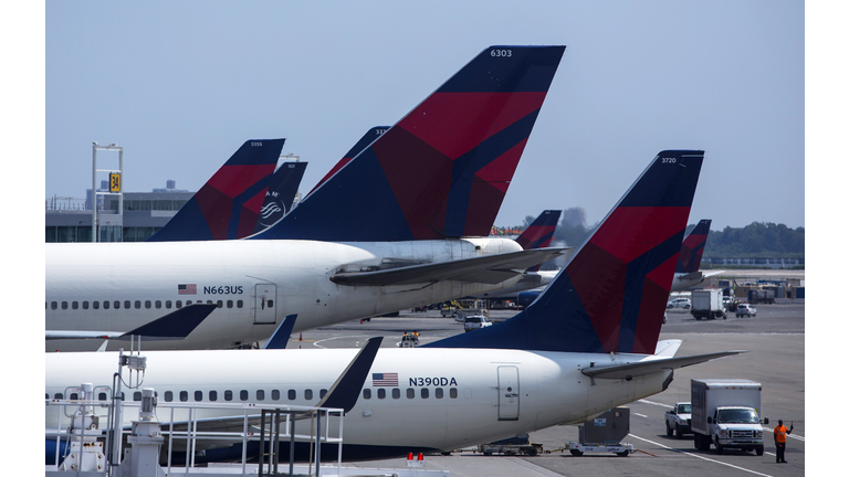 NEW YORK - JULY 22: Delta Airlines planes sit at Terminal 4 at John F. Kennedy Airport July 22, 2014 in New York City. The Federal Aviation Administration (FAA) has halted all flights from the U.S. to Tel Aviv, Israel following a rocket attack near Ben Gurion International Airport. (Photo by Eric Thayer/Getty Images)