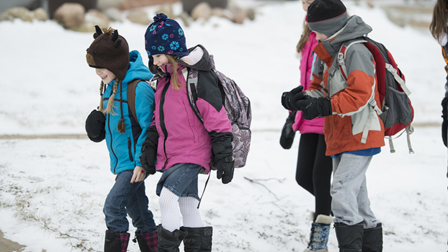 kids walking to school in the snow