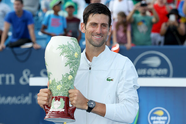 Novak Djokovic hoists the Western and Southern Open trophy