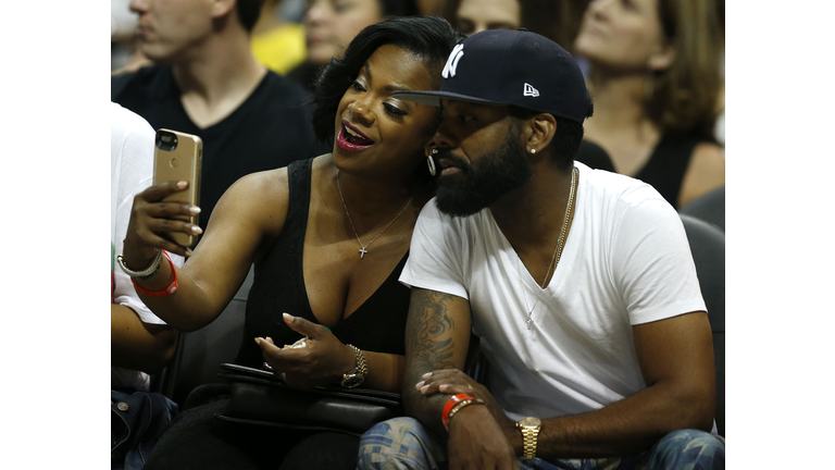 Washington Wizards v Atlanta Hawks - Game Six ATLANTA, GA - APRIL 28: 'Real Housewives of Atlanta' cast member Kandi Burress takes a selfie with her husband, Todd Tucker, during Game Six of the Eastern Conference Quarterfinals between the Atlanta Hawks and the Washington Wizards at Philips Arena on April 28, 2017 in Atlanta, Georgia. NOTE TO USER: User expressly acknowledges and agrees that, by downloading and or using this photograph, User is consenting to the terms and conditions of the Getty Images License Agreement. (Photo by Mike Zarrilli/Getty Images)