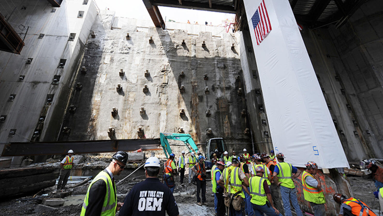 The historic “Last Column,” (covered in white) the final steel beam to be removed from the World Trade Center (WTC) site is returned August 24, 2009 for permanent installation in the 9/11 Memorial Museum at the WTC site in New York