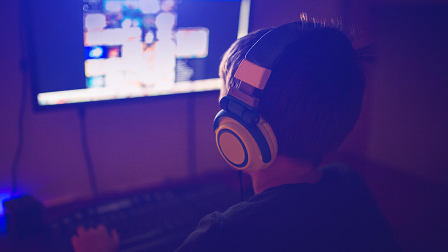 teenager playing computer game