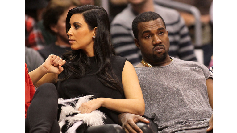 enver Nuggets v Los Angeles Clippers LOS ANGELES, CA - DECEMBER 25: Kim Kardashian and Kanye West attend the NBA game between the Denver Nuggets and the Los Angeles Clippers at Staples Center on December 25, 2012 in Los Angeles, California. The Clippers defeated the Nuggets 112-100. NOTE TO USER: User expressly acknowledges and agrees that, by downloading and or using this photograph, User is consenting to the terms and conditions of the Getty Images License Agreement. (Photo by Victor Decolongon/Getty Images)