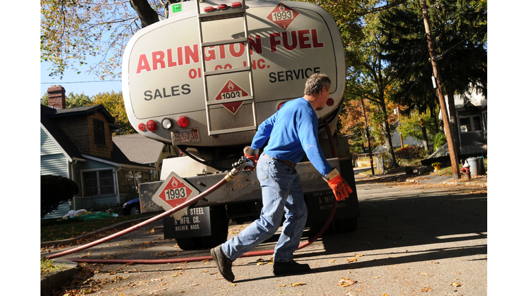 ARLINGTON, MA - OCTOBER 20: Mike Walsh of Arlington Fuel Oil Co., Inc. makes a delivery of home heating oil October 20, 2008 in Arlington, Massachusetts. Home heating oil prices continue to fluctuate in the recent uncertain economy and late last week the government released $5.1 billion in fuel assistance to states to help poor people cope with the high costs of fuel expected this winter. (Photo by Darren McCollester/Getty Images)