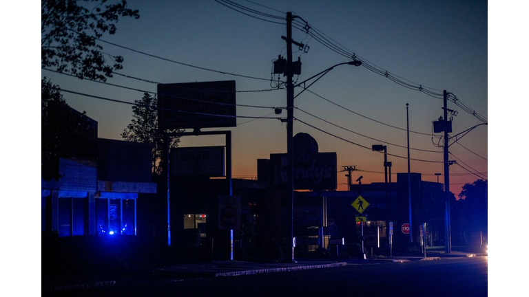 LAWRENCE, MA - SEPTEMBER 13: Police lights illuminate Winthrop St. after the power was cut to the entire city of Lawrence and other surrounding communities becuase of an outbreak of fires caused by over pressurized gas lines on September 13, 2018 in Lawrence, Massachusetts. Dozens of fires broke out in Lawrence, North Andover and Andover because of the gas lines. (Photo by Scott Eisen/Getty Images)
