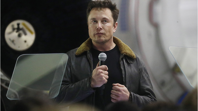 SpaceX CEO Elon Musk speaks at a press conference at SpaceX headquarters where he announced the Japanese billionaire chosen by the company to fly around the moon