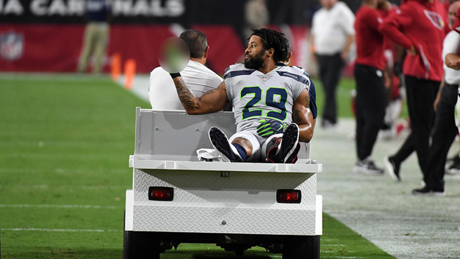 Defensive back Earl Thomas #29 of the Seattle Seahawks gestures as he leaves the field on a cart after being injured during the fourth quarter against the Arizona Cardinals