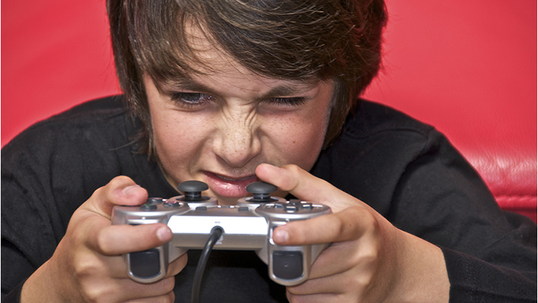 young boy playing video games