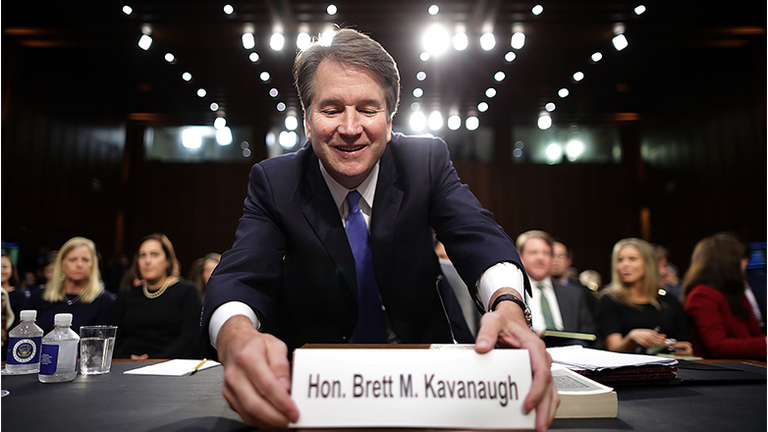 Supreme Court nominee Judge Brett Kavanaugh organizes his desk before testifying to the Senate Judiciary Committee