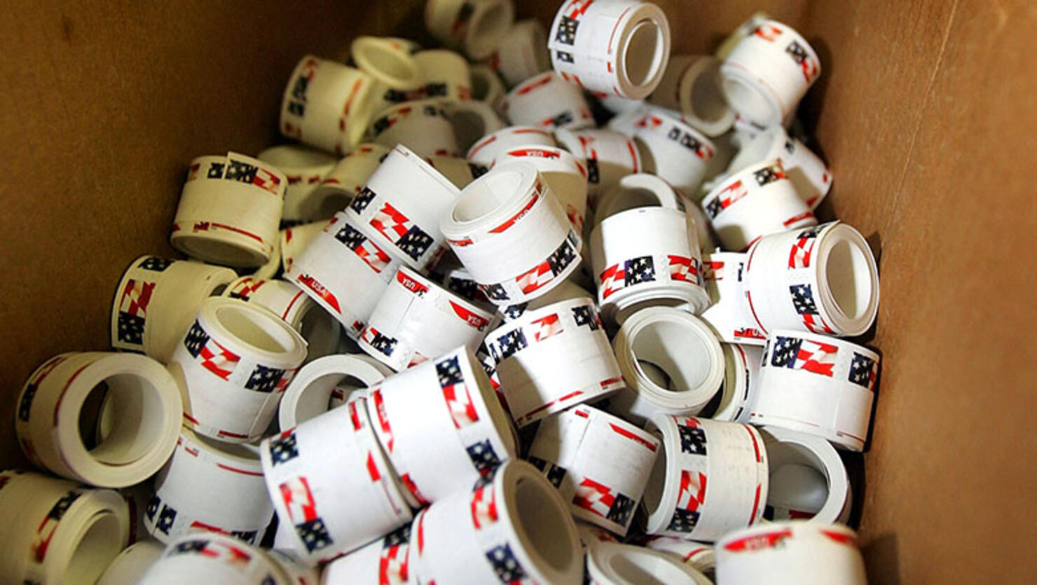 Newly printed rolls of stamps await packaging at the United States Treasury Bureau of Engraving and Printing facility