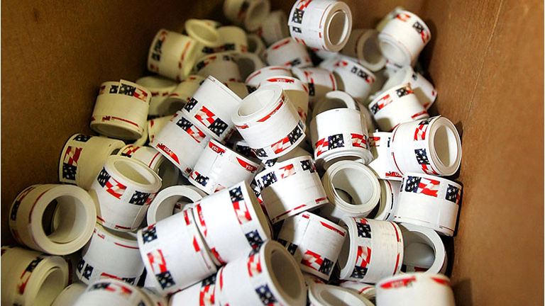 Newly printed rolls of stamps await packaging at the United States Treasury Bureau of Engraving and Printing facility