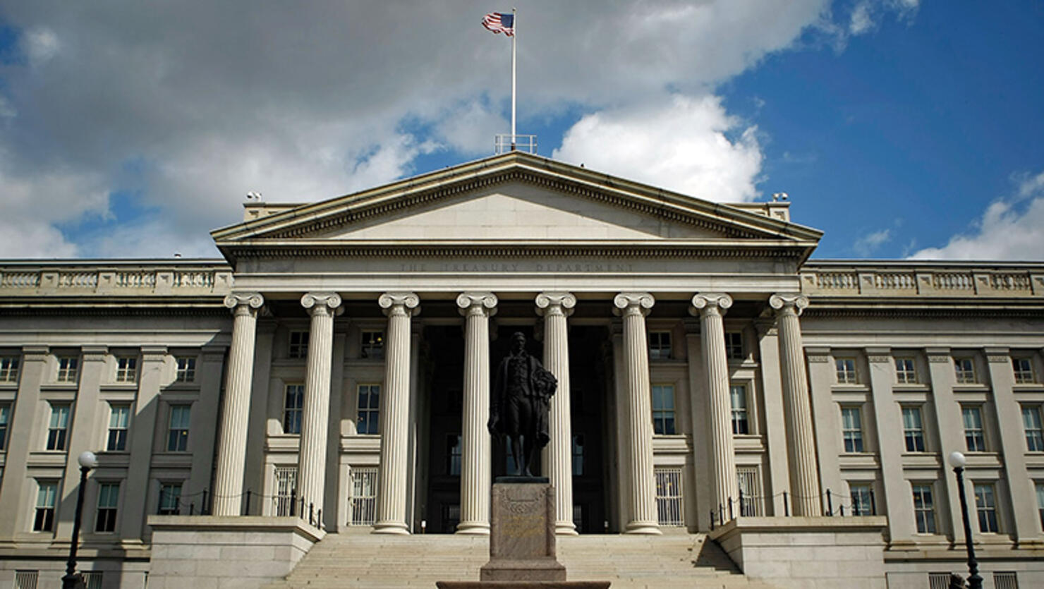 A statue of the first United States Secretary of the Treasury Alexander Hamilton stands in front of the U.S. Treasury 
