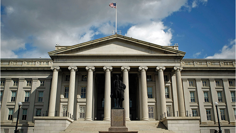 A statue of the first United States Secretary of the Treasury Alexander Hamilton stands in front of the U.S. Treasury 