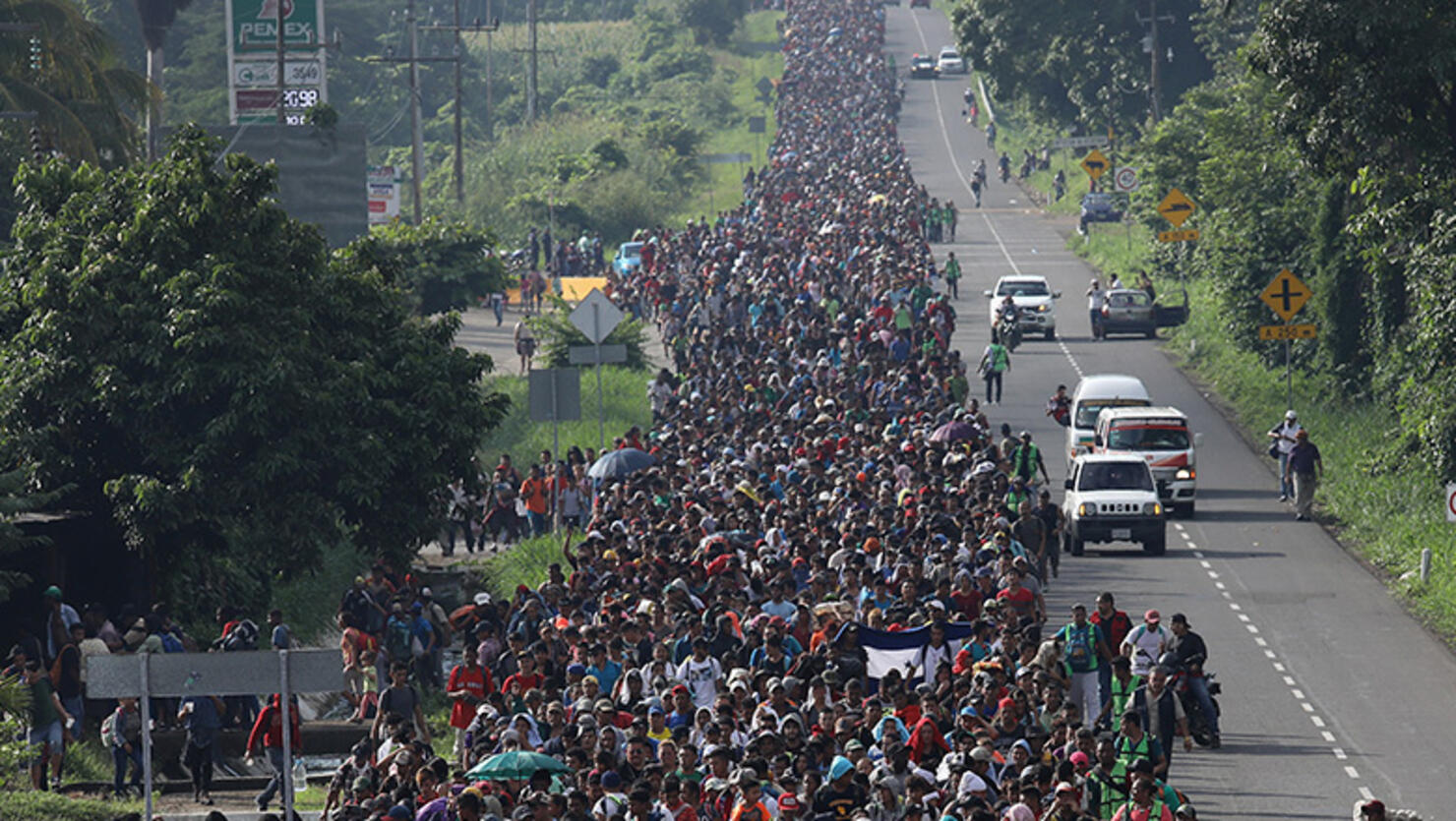 A migrant caravan, which has grown into the thousands, walks into the interior of Mexico after crossing the Guatemalan border
